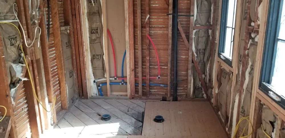 Water and drain lines installed during a bathroom rough-in